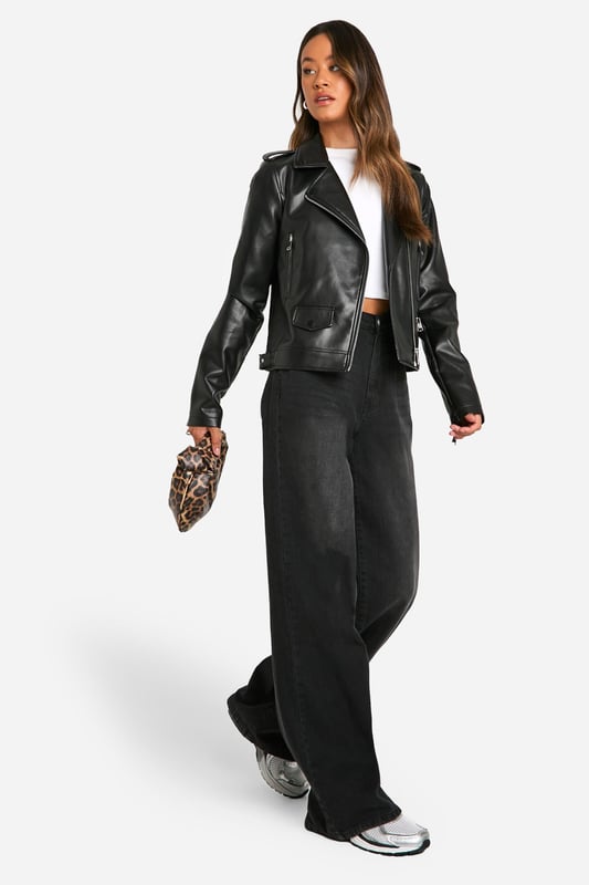 Classic biker jacket silhouette with notched lapels
        Asymmetrical front zip closure for edgy appeal
        Multiple functional zipped pockets for practicality
        Adjustable waist belt for a customised fit
        Long sleeves with zip cuffs for added style
    
    Embrace your inner rebel with this timeless tall biker jacket from Boohoo. Perfect for the fashion-forward woman who craves versatility, this jacket effortlessly transitions from day to night. Style it with wide-leg trousers and trainers for a casual daytime look, or throw it over a mini dress and ankle boots for an evening out with friends. The jacket's sleek silhouette and edgy details make it an ideal choice for family gatherings or casual events where you want to make a statement without overdoing it. Its adaptable nature allows you to create countless outfits, ensuring you're always on-trend and ready for any occasion. Easy to maintain with a simple wipe-down, this jacket is a practical yet stylish addition to your wardrobe that will serve you well for seasons to come.