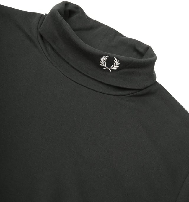 Fred Perry re-imagine classic silhouettes with refined textures and smart  modernist details. The Fred Perry Roll Neck Top is the perfect layering piece to add to your collection. Crafted from pure BCI interlock cotton jersey in a slim fit  creating a streamlined look. Featuring a classic roll neck with the iconic Fred Perry Laurel Wreath embroidery at the neck.BCI - By buying BCI cotton products  you're supporting more responsibly grown cotton through the Better Cotton Initiative. -Slim Fit-Pure BCI Interlock Cotton Jersey-Roll Neck-Long Sleeves-Ribbed Trims-Fred Perry Branding