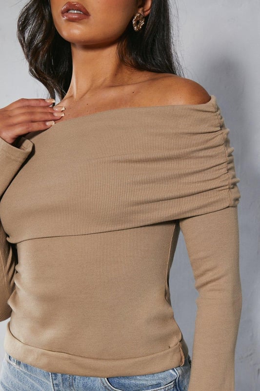 Bardot off-shoulder neckline
Long sleeves with ribbed texture  
Form-fitting stretch jersey fabric
Straight hem cut

This on-trend bardot top from Misspap features an alluring off-shoulder design with long sleeves. Crafted from a soft stretch jersey fabric with a body-hugging fit, it flatters the figure beautifully. The ribbed texture adds visual interest. Pair this versatile top with high-waisted jeans or a skirt for a chic day or night look. It works well layered under leather and denim jackets too. The fold-over bardot neckline is perfect for showcasing dainty necklaces. For a going-out look, style with heels and statement earrings to be the centre of attention. This top transitions seamlessly from casual daywear to evening cocktails.