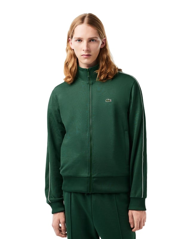 This regular-fit men's sweat jacket with contrasting stripes is a stylish basic. Made from high-quality material, it is extremely comfortable to wear. It fastens with a zipper that ends in a stand-up collar. The sleeves and hem are finished with plain-colored ribbed cuffs. Essentials can be stowed in the side slit pockets. The contrasting stripes on the sleeves provide a subtle visual highlight.