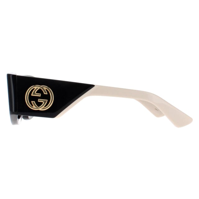 Gucci Rectangle Womens Black with Ivory Grey GG1664S  Sunglasses boast an elegantly oversized silhouette with sharp, clean lines and a touch of retro charm. The sophisticated frame is accentuated by Gucciâ€™s iconic double-G logo on the temples, symbolizing luxury and fine craftsmanship. Equipped with premium lenses that provide superior UV protection, the GG1664S ensures both style and functionality. Available in a variety of striking color options, these sunglasses are perfect for fashion-forward individuals who seek to express their unique sense of style with a touch of timeless elegance.