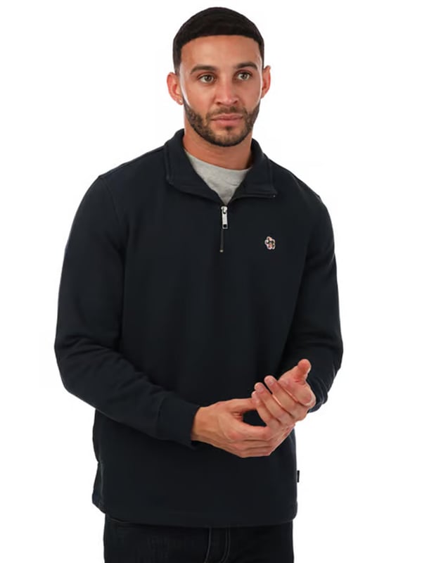 Actualiza tu vestuario casual con el suéter de media cremallera para hombre Ted Baker Kilburn en gris. Con un elegante cuello alto y cierre de media cremallera para mayor comodidad, este suéter ofrece tanto estilo como confort. Incluye puños y dobladillo acanalados para un ajuste perfecto, mientras que el adorno de Magnolia característico agrega un toque refinado. Hecho de 100% algodón, esta prenda de ajuste regular es ideal para el día a día