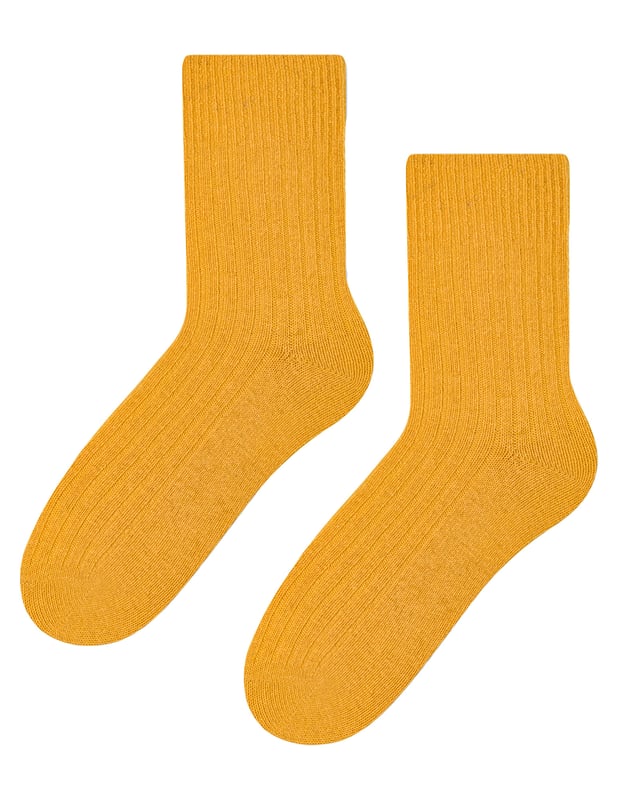 When the beautiful weather comes to an end and gives way to autumn and winter, you’ll need the right dress socks for the everyday to keep you comfortable and warm. These ribbed wool dress socks by Steven are the ideal pair! Wool is a great material that has many properties: it is antiallergic, antifungal and antibacterial, it perfectly absorbs moisture, in addition, the wool fibre is extremely thin, delicate to the touch. These ladies wool socks have been designed with a ribbed leg to maximise comfort and help them stay up all day, they are also soft, delicate and will keep you very warm during colder days. The socks come in over 10 different colours, so there is something for everyone! They include: Black, Pink, Blue, Burgundy, Turquoise, Beige, Navy and more. Whether you prefer a traditional black or a funky pink, we have something to suit your style. These Ladies Socks are available in 2 sizes: 3-4 UK, 5-7 UK and are made from 72% Wool, 26% Polyamide, 2% Elastane. There are 11 colours to choose from and are fully Machine Washable.