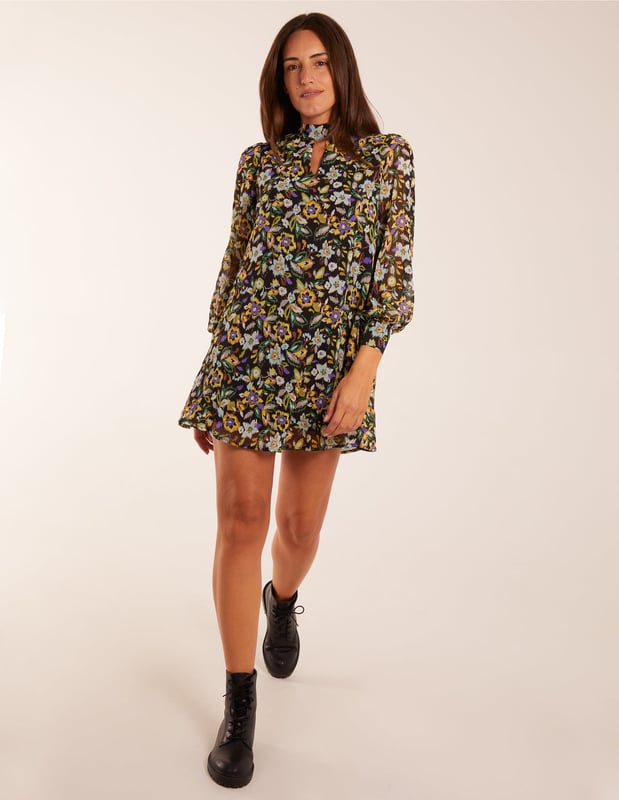 This chiffon swing dress provides everything you need this AW! Team this beautiful detailed dress with knee high boots and tights, along with a leather looked jacket to complete the look!