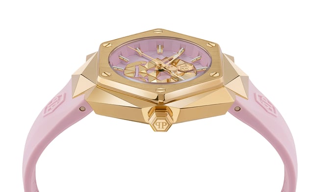 This Philipp Plein $kull Spikes Analogue Watch for Women is the perfect timepiece to wear or to gift. It's Gold 40 mm Round case combined with the comfortable Pink Silicone watch band will ensure you enjoy this stunning timepiece without any compromise. Operated by a high quality Quartz movement and water resistant to 5 bars, your watch will keep ticking. Philipp Plein has certainly understood that femininity can be fierce, and that the most elegant moments often arise from the boldest of actions. This Analogue watch has a  function: Luminous Hands and Luminous Numbers High quality 19 cm length and 21 mm width Pink Silicone strap with a Buckle Case diameter: 40 mm,case thickness: 11 mm, case colour: Gold and dial colour: Pink