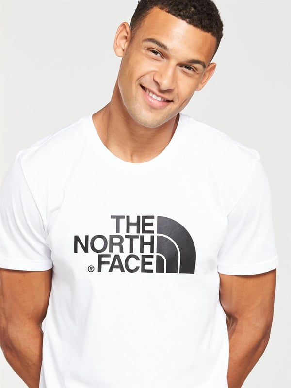 The North Face Mens Short Sleeve Easy Tee.     
Pressed Plastisol Print at Front.     
The North Face Logo on the Back of the Shoulder.     
Classic Length Short-sleeve T-shirt With Crew Neck.      
100% Cotton.     
Machine Washable (Please See Care Label).     
The North Face Mens T Shirt TNF Short Sleeve Crew Neck Cotton Casual Easy Tee.
