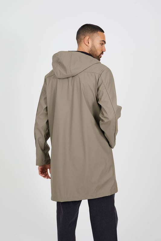 Designed for practicality this parka style jacket from Brave Soul is crafted from durable rubberised fabric, offering weather protection while maintaining a modern, sleek look. Featuring a popper fastening for added convenience and secure closure, and two lower pockets, perfect for storing your essentials. Shop now and elevate your outerwear game with this must-have coat. Model wears UK size M.