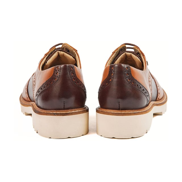 The KORTNEY is a timeless brogue style featuring subtle POD branding and sleek stitching details. The chunky sole gives an added edge to an otherwise classic style. The style is finished with tonal laces and blind eyelets