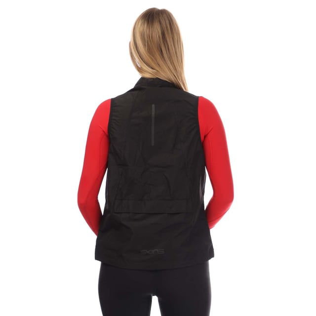 Womens Skins Series-3 Running Gilet in black.- Full zip fastening.- Rear pocket.- Elasticated arm holes.- Adjustable drawcord hem.- Reflective tonal black logos.- Rear pocket can be used to pack up and store the gilet.- Packable.- Showerproof.- 100% Polyester.- Ref: ST40731249001