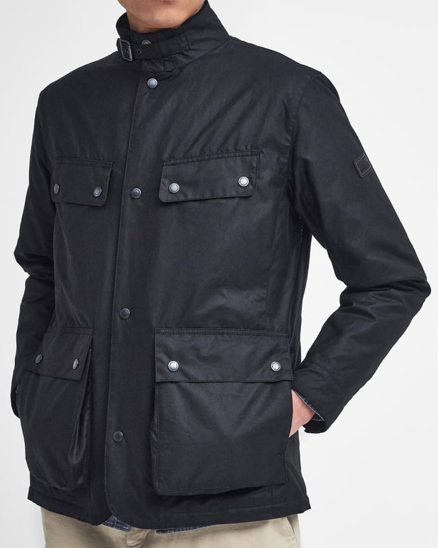 B.Intl Wellstone Wax Jacket
Fuelled by our motorcycle heritage, the B.Intl Wellston Waxed Jacket is a reflection of the premium quality and attention to detail that make our jackets so recognisable. Crafted from our classic waxed cotton and detailed with a multitude of pockets, this waxed jacket boasts authentic style with an abundance of attitude. Featuring a stand collar with a throat buckle, it's complete with a baffle quilted lining for optimal warmth in the colder months.

Tailored fit
6oz wax
Outer: 100% Cotton (Waxed)
Inner: 100% Polyester
Trim: 100% Cotton
Do not wash
Sponge clean only
Back length: 74.5cm

MWX2375
