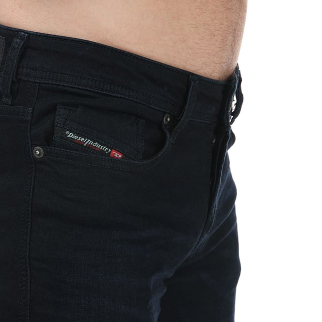 Mens Diesel Sleenker -X Skinny Fit Jeans in navy.- 5-pocket construction. - Full branded button fly.- Six belt loops on the waistband.- Top stitch detail.- Branded strip across small pocket.- Signature Diesel logo patch on the reverse right side of the waistband.- Skinny fit. - 98% Cotton  2% Elastane.- Ref: 00SWJE0095X01