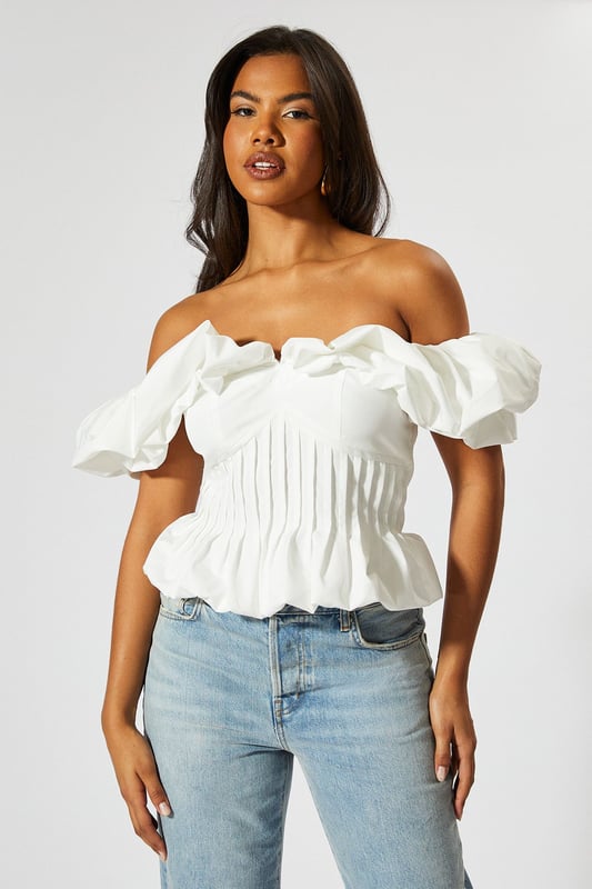Striking bardot neckline with ruffle detail
        Cinched waist for a flattering silhouette
        Off-shoulder design with short sleeves
        Textured fabric with vertical pleating
        Cropped length perfect for high-waisted bottoms
    
    Make a statement with this eye-catching Ruffle Bardot Cinched Waist Top from MissPap. The off-shoulder design with its dramatic ruffle detail creates a captivating look that's sure to turn heads. The cinched waist accentuates your figure, while the vertical pleating adds texture and interest. Perfect for those who love to be the centre of attention, this top pairs beautifully with high-waisted jeans for a casual yet stylish ensemble. Dress it up with a sleek skirt and heels for a night out, or keep it relaxed with wide-leg trousers and trainers for a chic daytime look. Whether you're heading to a family gathering or meeting friends for drinks, this versatile piece allows you to customise your style to suit any casual occasion. The cropped length is ideal for showing off your favourite bottoms, making it a must-have addition to your wardrobe.
