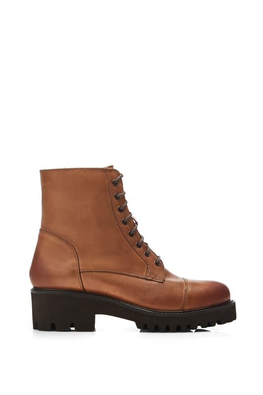 Add Aristea to your boot collection. Featuring a chunky cleated sole to add height and grip, fusing fashion with function for the ultimate wear. The faux fur lining and soft leather sock ensures the boot feels as good as it looks.