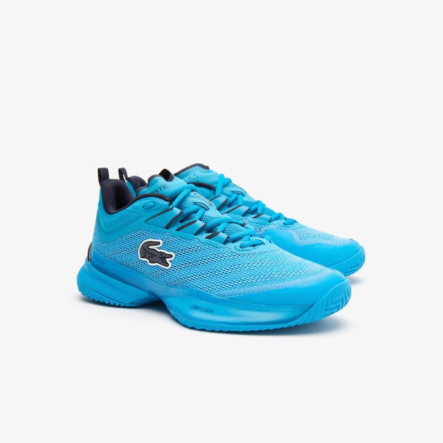 A new model this season  the AG-LT23 Ultra is designed to push tennis players’ abilities further than ever before with their lightweight and responsive design. From the Pebax technology that provides energy return  via the LSRFoam forefoot midsole  in combination with the enhanced stability offered from the TPU Plate Chassis and Heel Stabiliser  to the engineered breathable leno ‘Pique’ weave mesh upper for enhanced fit & breathability  they’re the innovative shoe every player needs to up their game. The outsole features Lacoste's brand new rubber compound; LineGrip. - Pro level performance Tennis shoe offering enhanced stability - Engineered breathable leno ‘Pique’ weave mesh upper for enhanced fit & breathability - Internal midfoot lockdown cage - Lacoste Super Responsive (LSR) Foam midsole in the Forefoot - High Performance EVA Foam in the Heel for enhances shock absorption - Full-length TPU plate chassis and heel stabilizer - 'LineGrip' Rubber Outsole - Ref: 745SFA001111C