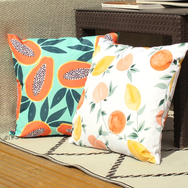 Amongst the green leaves, features a vibrant Papaya fruit print in bold oranges and tropical greens. Pop it in your outdoor space, it is sure to stand out.