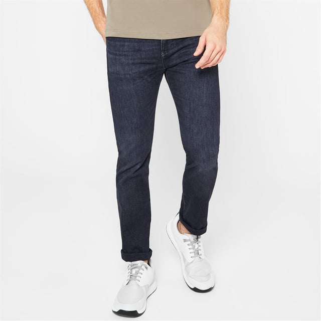 Hugo Boss Slim Delaware Jeans - Upgrade your wardrobe and transform your weekend collection with these Hugo Boss Slim Delaware Jeans. Cut to a slim fit, this pair of raw jeans feature a zip fly button fastening and belt loops for a secure and comfortable fit. Finished with the classic five-pocket styling and a brand tag at the back, you can pair them with a bomber jacket and Chelsea boots for a modern biker inspired look. - >Men's Jeans - >Tapered Fit - >Zip Fly - >Button Fastening - >Belt Loops - >5 Pockets - >Raw Denim - >Brand Badge on the Back - >Hugo Boss Branding - >60% Cotton, 40% Polyester - >Machine Washable - >Keep Away From Fire