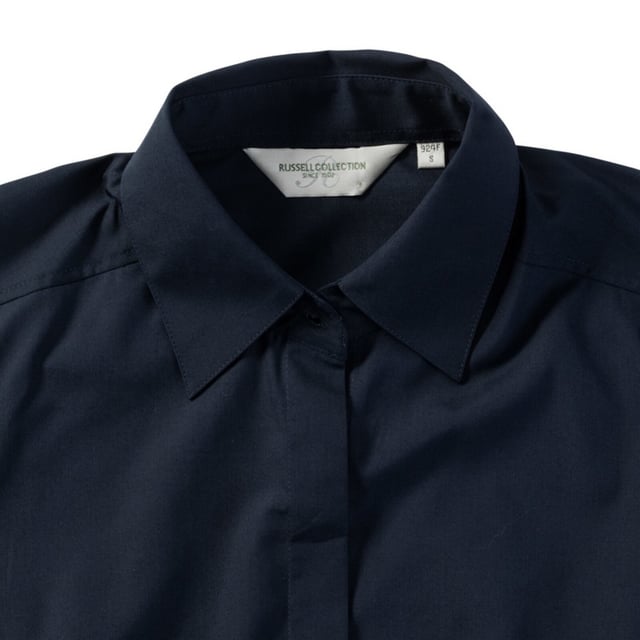 One of the great classic shirt fabrics, combining elegance with durability and wearer comfort. Smart and stylish fitted shirt design in a fine poplin fabric. Concealed placket. Stylish yoke design. Darts on bust front hem and back panel for fitted shape. Decorative top stitch on darts. Modern rounded 2 button cuffs. Rounded hem. The elegant lightweight fabric is especially suited for finer embroideries. Also available in mens sizes, code 924M. Weight: 110- 115g/m². Fabric: 65% Polyester, 35% Cotton. XS (30-32: To Fit (ins), 8: Dress Size). S (32-34: To Fit (ins), 10: Dress Size). M (34-36: To Fit (ins), 12: Dress Size). L (36-38: To Fit (ins), 14: Dress Size). XL (38-41: To Fit (ins), 16: Dress Size). 2XL (41-44: To Fit (ins), 18: Dress Size). 3XL (44-47: To Fit (ins), 20: Dress Size). 4XL (47-51: To Fit (ins), 22: Dress Size). RUSSELL COLLECTION - a variety of Mens and Womens corporatewear in a wide range of styles, colours and sizes.
