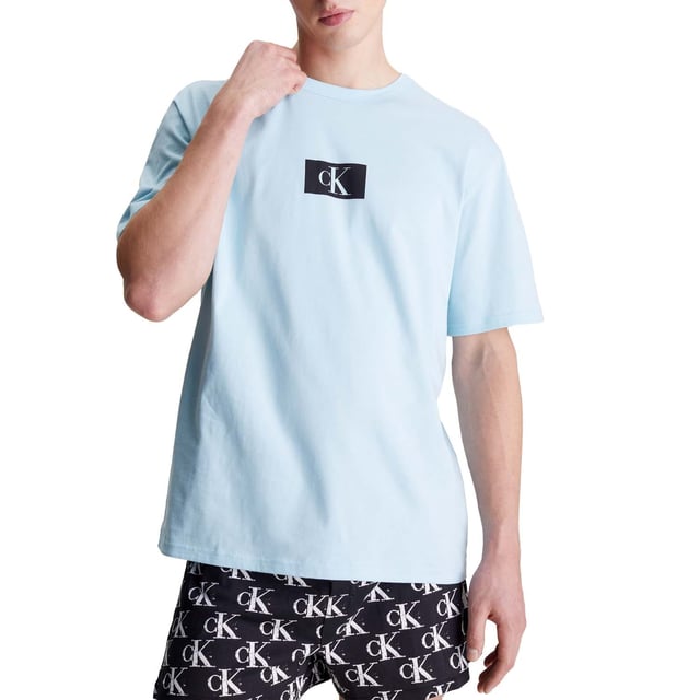 Mens Calvin Klein Lounge T- Shirt in blue.- Crewneck.- Short sleeves.- Signature tape inside the collar.- Iconic Calvin Klein monogram logo on the chest.- Regular fit.- Ref: 000NM2399ECAV