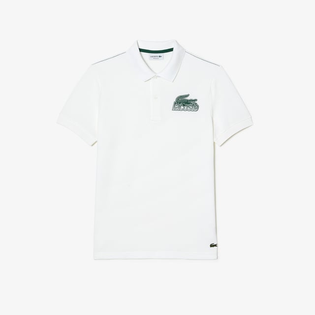 Proud of Lacoste’s DNA  revisiting our iconics in a contemporary way Regular fit  natural ease on body Iconic petit pique Graphic polo 2 rubber buttons placket 3cm green crocodile at bottom garment - left side when worn Lacoste stripe gradient and crocodile print at chest