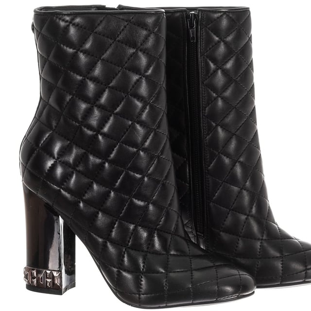 Boots with original design.
 Round toe.
 Quilted finish.
 Metal application of the brand on the back
 Template customized by the brand.
 Rubber sole with non-slip grooves.
 Metallic detail on heel.
 Seams seen in tone.
 Measures: Heel: 10cm
 Composition: Exterior: Leather; Interior: Leather; Sole: Synthetic
 Care:
Hand wash with a damp cloth.