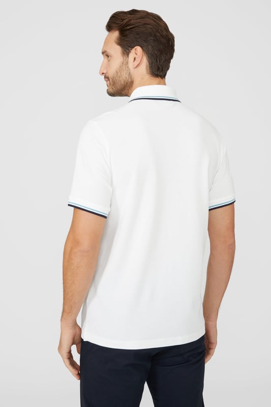 Introducing our Pique Tipped Polo, the perfect addition to any man's smart casual wardrobe. Crafted with meticulous attention to detail, this polo offers a sophisticated and polished look. The pique fabric provides a comfortable and breathable feel, making it ideal for all-day wear. With its stylish tipped collar and cuffs, this polo adds a touch of elegance to any outfit. Whether you're heading to the office or out for a casual gathering, our Pique Tipped Polo is the ultimate choice for a smart and effortlessly stylish look.