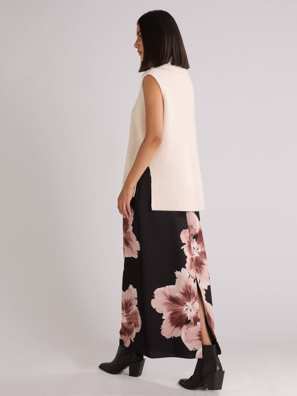 Co-founders' Notes

Our Mono Floral Placement Print Skirt is made from a recycled polyester mix satin back crepe, features a new mono floral design. This fully lined skirt includes a back zip, and a back skirt split for ease of wear. Its long midi length offers a stylish and comfortable fit.

Zip in back

Split in back skirt
Long midi length
True to size. Try your usual size



 Fabric &amp; Care



 Composition:   Main: 51% Recycled Polyester 49% Polyester Lining: 100% Viscose


 Garment Care:  Machine Washable


 Size &amp; Fit


True to size. Try your usual size

 Length: 90cm (size 10) 

Model is 170 cm/5'7" and is wearing a size 10