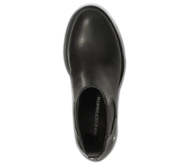 The Windsor Smith Replace boots are a stylish take on the classic Chelsea boot, featuring a sleek black leather upper and a timeless round toe design. With double woven elastic gussets and a leather pull tab, these boots provide easy on-and-off wear while maintaining a sophisticated look.

Sleek Leather Upper: Crafted from high-quality leather for a polished look.
Comfortable Non-Leather Lining: Soft lining enhances comfort for all-day wear.
Durable Non-Leather Sole: Provides reliable traction and stability.
Classic Round Toe: Timeless design that complements any outfit.
Elegant Chelsea Style: A chic addition to your footwear collection.
Moderate Heel Height: 50 mm heel offers a perfect blend of style and comfort.
Secure Fit: Features double woven elastic gussets for easy access and a snug fit.
Convenient Leather Pull Tab: Allows for quick and effortless on-and-off wear.Leather pull tab