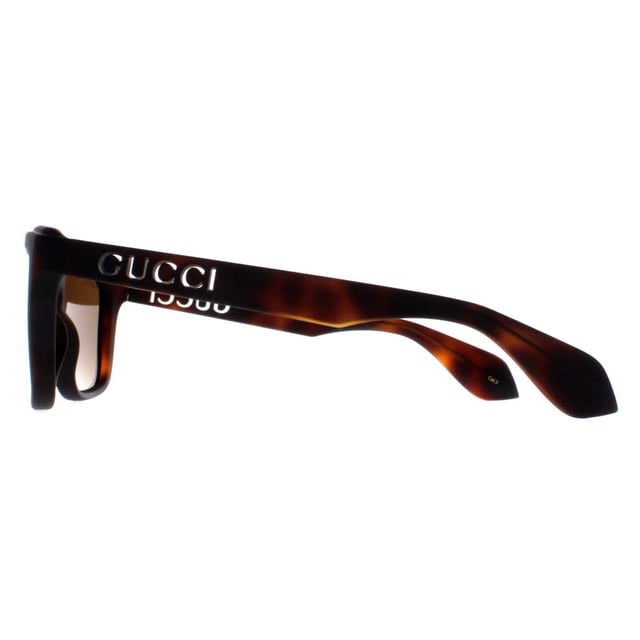 Gucci Rectangle Unisex Havana Brown GG1571S  Sunglasses showcase a contemporary rectangle design that seamlessly merges sophistication with bold fashion. The sleek and refined frame, adorned with the iconic Gucci logo detailing on the temples, exudes luxury at every glance. Precision engineered from premium materials, these shades prioritize comfort without compromising on durability, making them the perfect accessory for both fashion aficionados and trendsetters. Whether you're lounging poolside or striding through the city streets, the Gucci sunglasses are a testament to refined taste and unparalleled craftsmanship.