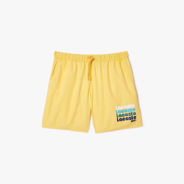 Mid Length Washed Effect Ombré Print Swim Trunks Recycled Polyester Taffeta Elasticated waistband with drawstring 2 pockets on sides  1 pocket on back Mesh lining Embroidered crocodile on front