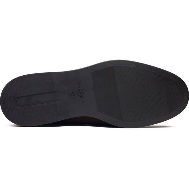 Hackett London Martin Signature Zapatos Los mocasines Hackett London Martin Signature, una versión en ante de los mocasines clásicos, están confeccionados en Portugal con cuero flexible y suela de goma. Estos zapatos encarnan el estilo con un toque moderno. Los detalles de costura aportan estilo, mientras que el forro de cuero y el logotipo estampado ofrecen una sutil sofisticación. Perfectos con jeans o pantalones, estos mocasines realzarán cualquier look.