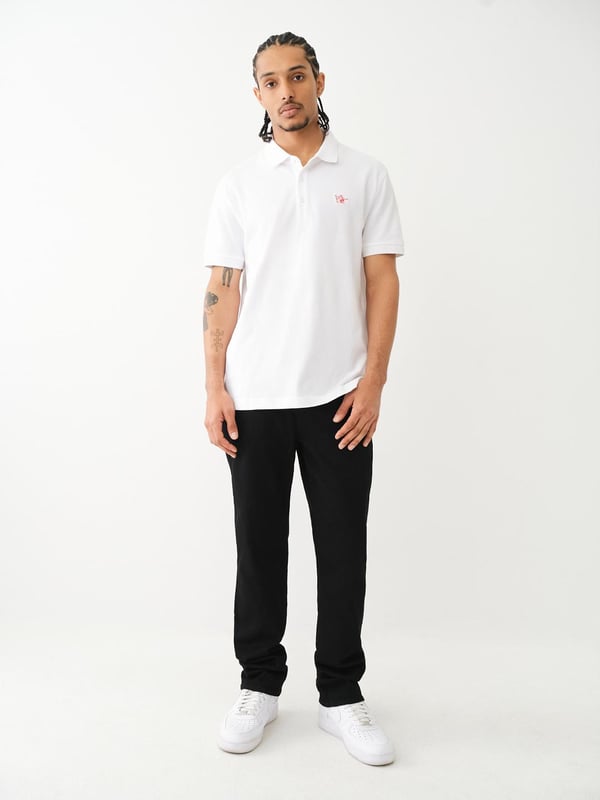 Pop that collar with the Buddha Patched Logo Polo Shirt. Crafted from soft cotton, this men’s polo features a basic collar. half-button placket, and short sleeves. Finished with a relaxed fit, ribbed trim, and a chest Buddha patch.