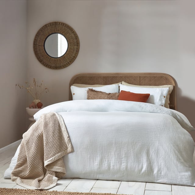 Inspired by timeless classic fabrics, the Lark duvet cover set is made from ultra-soft double-layer muslin cotton fabric. Available in a range of pastel tones, this bedding is complete with a wooden button closure. The cosy crinkle texture is perfect for bringing a relaxed, stylish feel to your bedroom. Cool and breathable in the summer months and snuggly and warm in the winter, muslin is used on both sides for an understated yet modern look. This product is certified by OEKO-TEX®, showing it has been sustainably made.
