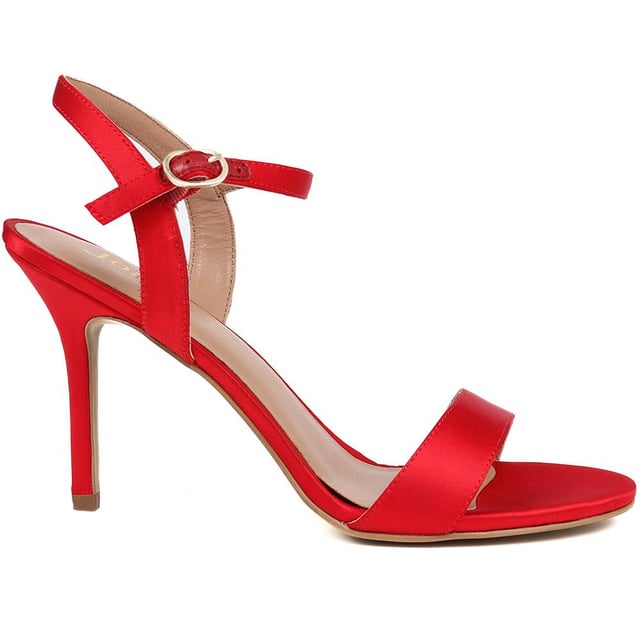 Strut into style with satin elegance. Classic cut meets undeniable allure, creating sandals that are always on the guest list. Crafted with full leather linings, our KINSLEY stiletto sandals combine cushioned comfort with timeless tailoring. Every party deserves a touch of timeless glamour.