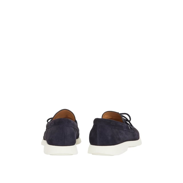 A slip on shoe with suede uppers featuring decorative tassels across the vamp in dark blue suede and all over dark blue stitch details. Two silver branded eyelets situated on the outstep and instep with the signature BOSS logo embossed on the outstep of the heel. A textured rubber midsole in off white with a branded and textured rubber undersole in off white.