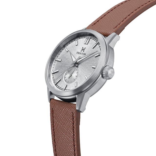 316L Surgical-Quality Stainless Steel Case, Jeweled Automatic Movement, Jewel Bearings: 22 Jewels, 36-Hour Power Reserve, Beats per Hour (BPH): 21600/Hour, Sapphire-Coated Mineral Crystal, Engraved Pattern Dial, Observation Caseback to view Movement, Logo-Engraved Crown, Genuine Leather Pattern-Embossed Strap, Logo-Engraved Stainless Steel Clasp, Luminous Hands, Luminous Markers, Dual Time Sub-Dial, 45mm Case Diameter, 195-245mm Wrist Size, 10 ATM Water Resistance.
