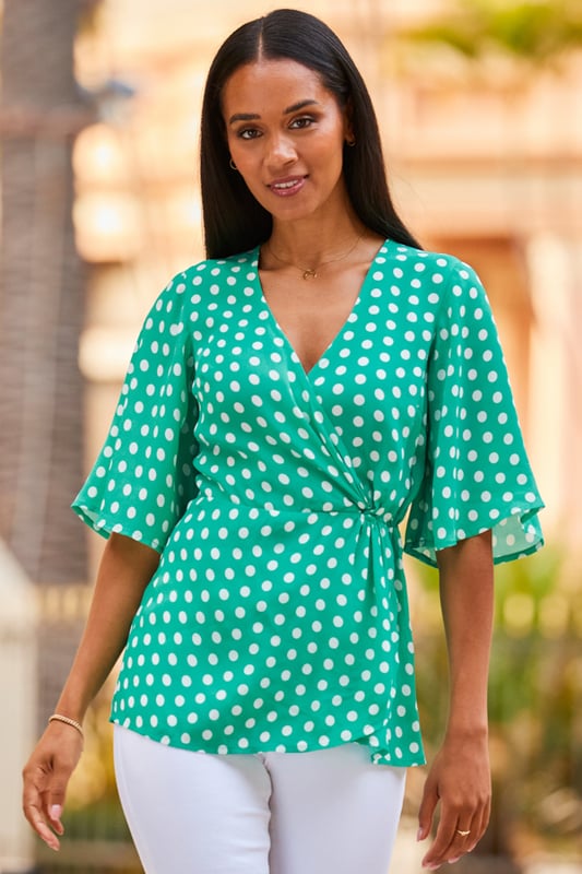 REASONS TO BUY:

Your jeans deserve it
Nothing flatters like a wrap top
Gorgeous draped sleeves
Polka dots: forever on-trend
It's work smart, weekend chic
Just add white jeans
