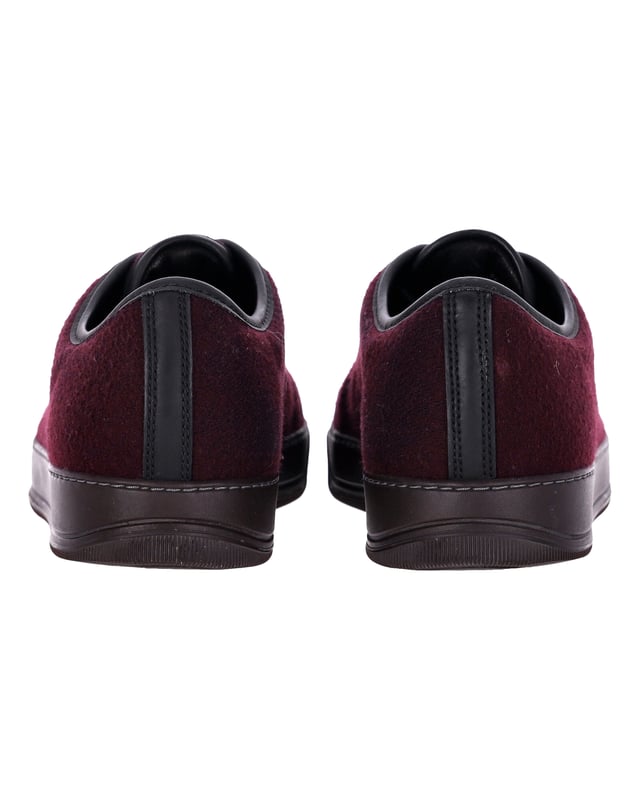 VINTAGE, RRP AS NEW
Elevate your sneaker game with the Lanvin DBB1 Matte Cap Toe Low Top Sneaker in Burgundy Suede. A true essential of the Lanvin men’s wardrobe, these sneakers are reimagined each season to offer a fresh take on a classic design. The low-top silhouette adds a casual touch, while the cap toe provides a refined, modern aesthetics. The burgundy suede material offers a sleek, sophisticated look that is perfect for any occasion. These sneakers embody the perfect blend of timeless style and contemporary flair, making them a must-have addition to any footwear collection. Make a statement with these Lanvin sneakers that seamlessly balance comfort and style.


With dust bag.

Lanvin DBB1 Matte Cap Toe Low Top Sneaker in Burgundy Suede
Color: Burgundy
Material: Suede
Condition: Very good
Size: EU40.5
Measurements: Heel height: 2; Insole length: 29
Signs of wear: Minor markings, Lightly used but very well maintained. Minor mark at soles & creasing, light scuffing at the soles and heels.
SKU: 367921