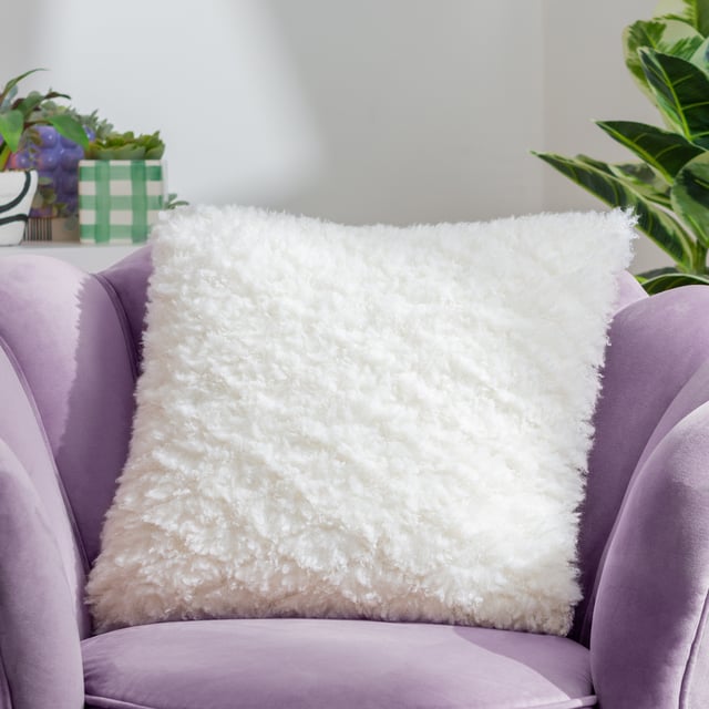 Give your room a bold boost. From dreamy cream for a neutral look to shocking shades that bring the drama, look no further. The Fluff Ball cushion is made from ridiculously soft faux fur statement fabric and is finished with a complementing velvet reverse. Perfect for those who love an injection of colour. Size: 45 x 45cm