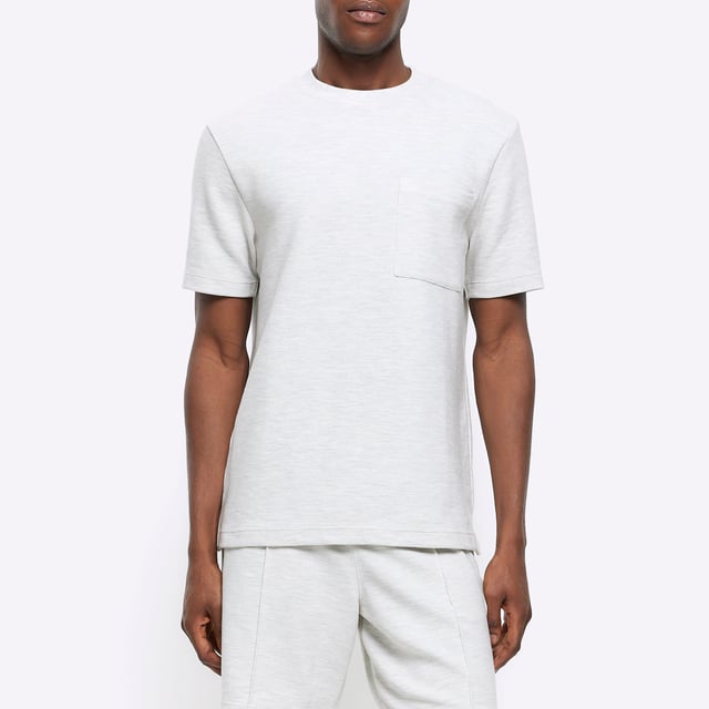 Regular fit, Textured fabric, Chest pocket, Crew neckline, Short sleeves, Cotton for this product has been more responsibly sourced