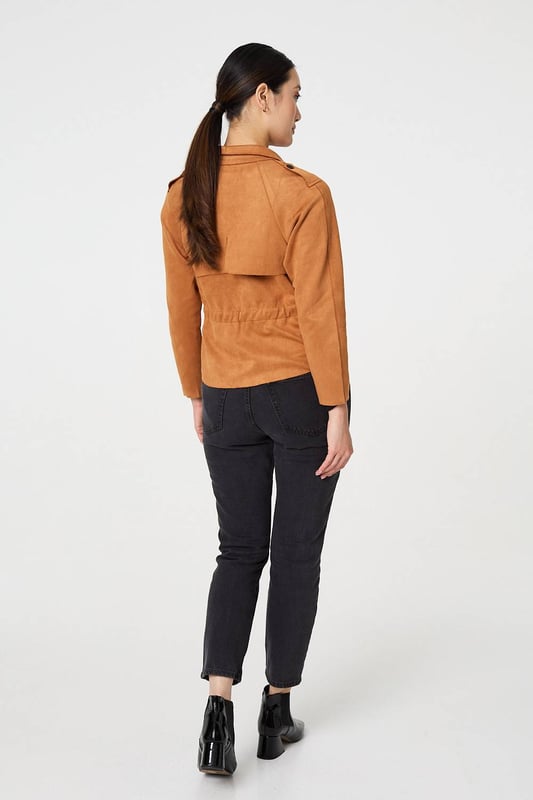 Add an extra layer lo your look with this cropped jacket. It's made from a soft suede feel fabric; and you can wear it over any outfit, including formal dresses or eveningwear. It has a lapel collar and button details, with long sleeves and a fitted shape. Pair this cropped jacket with smart trousers and you can wear it to work too.
