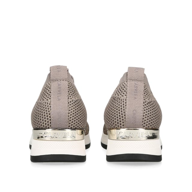 The Janeiro2 trainer from Carvela features a bronze knitted upper in a low top sock-style. There is a silver crystal embellishment across the shoe with gold tone Icon C metal stud and branded pull tab at the ankle.