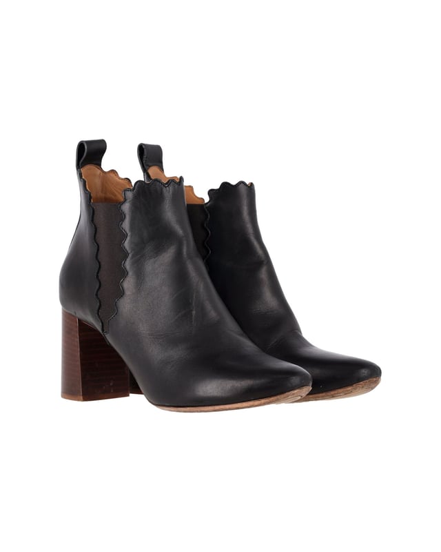 VINTAGE, RRP AS NEW
A blend of style and bold simplicity, these ankle boots from Chloé will sweetly complement your casual as well as evening ensemble. Crafted with black leather, the boots are characterized by the interesting scalloped detail adorning the elasticated panels and the top line. They are styled with covered block heels and round toes. Team these feminine boots with your skirts or fitted jeans.
Chloé Scalloped Chelsea Boots in Black Leather
Condition: good
Sign of wear: slight leather creasing and soles have scuffs & wear
SKU: 336646   
Color: black
Material: Leather
Size: EU39.5