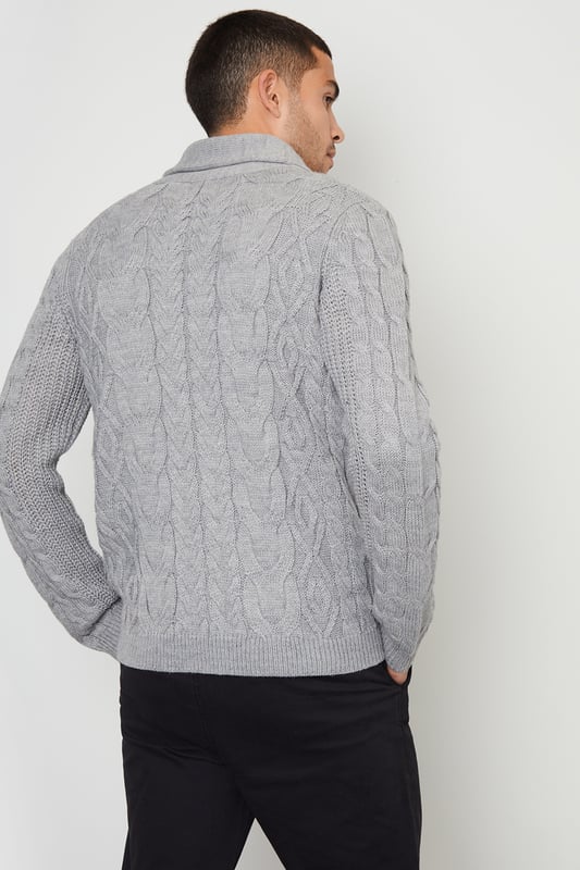 Upgrade your knitwear with this shawl collar knitted cardigan from Threadbare. With a stylish shawl collar and in a cable knit design, this jumper has ribbed cuffs and hem for comfort and full mock horn button fastening. Finished with two side welt pockets and the Threadbare metal branding tab on the hem. A great piece to have on hand for layering when the temperature drops. Pair with dark denim jeans and layer over a white tee for a stylish casual look.