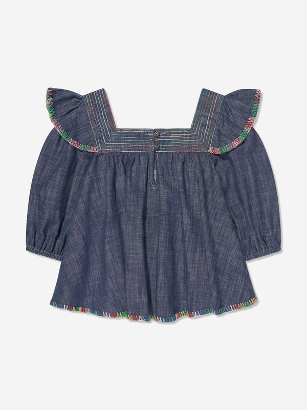 Australian label Zimmermann combine superior cutting with spellbinding silhouettes. This monsoon denim top is reflective of the brand's commitment to originality and high quality detailing. Crafted with a multi-hued embroidered trim, it features a square collar, a flounced trim on the shoulders and puff sleeves. It is complete with a small embroidered bee logo above the hem. Matching shorts are also available. Pure Cotton Button Fastening on Reverse 100% Cotton