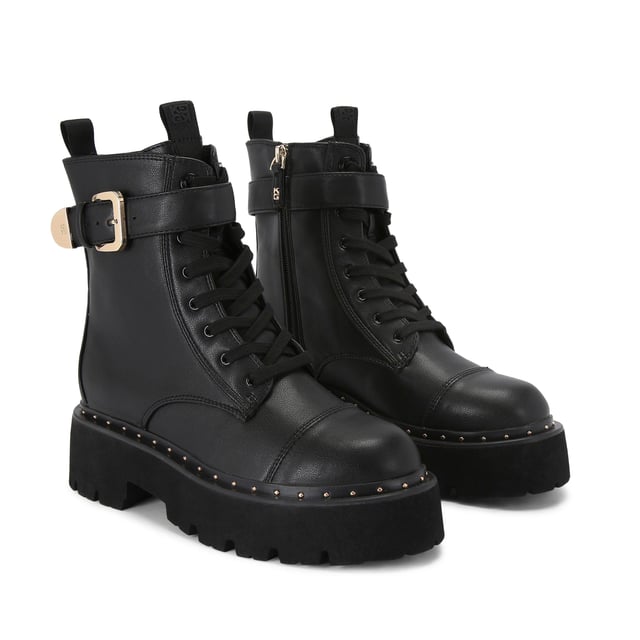 This KG Kurt Geiger Trick Lace Up Boot is a combat style boot with a gold tone buckled strap at the ankle. There is corresponding gold studs around the midsole.