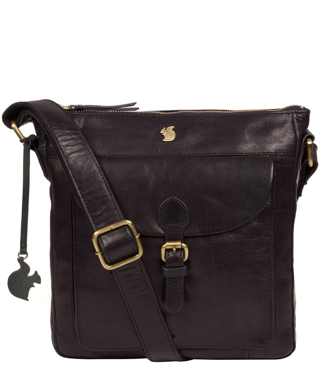 The 'Josephine' shoulder bag from Conkca London is crafted from vegetable-tanned leather for a richly textured finish. The zip-over top conceals a gorgeous, 100% natural, untreated cotton lining and two interior pockets. Featuring a mock buckle, the exterior pocket provides plentiful on-the-go storage. Comes with an adjustable fabric strap and is furnished with gold-coloured metal fittings. Adorned with the inimitable and charming Conkca London squirrel charm and logo for an eye-catching finish.