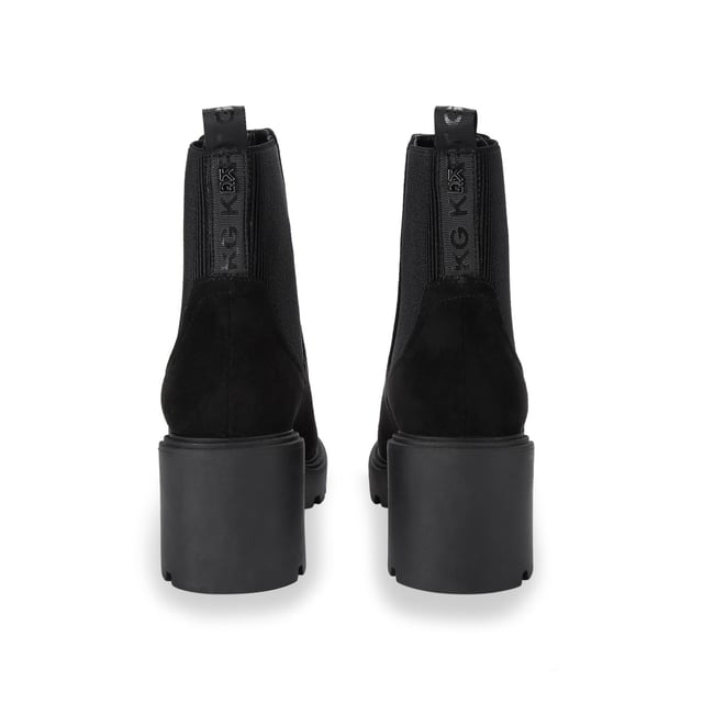The KG Kurt Geiger Turin boot features a black microsuede upper with elasticated panels at the sides. There is a KG Kurt Geiger branded tab at the back of the ankle for slip on ability. Heel height: 7cm.