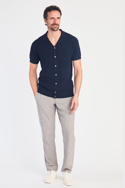 This knitted shirt from Kensington Eastside is a perfect mix of style and comfort. With a subtle checked pattern on the front and a laid-back Cuban collar, it’s an easy go-to for smart-casual outfits. Lightweight and breathable, it’s great for any occasion where you want to look sharp with minimal effort.