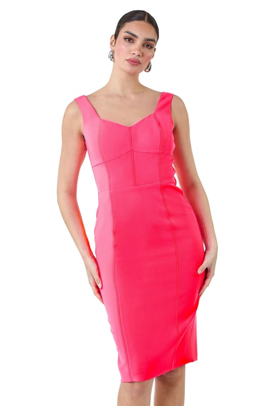 A-Plain Corset Drs from Roman. Get ready to be the best-dressed guest this season in our striking Ariella stretch dress. This knee-length stunner features a bold pop of colour and mock corsetry detailing that creates a flattering fit. The cute sweetheart neckline and feminine, fitted shape make it a special occasion staple, topped off with wide straps for comfort and coverage. Finished with a visible zip back fastening and crafted in stretch jersey fabric, this dress exudes effortless glamour. Pair with strappy heels and a fascinator for a wedding reception or a day at the races this Summer.