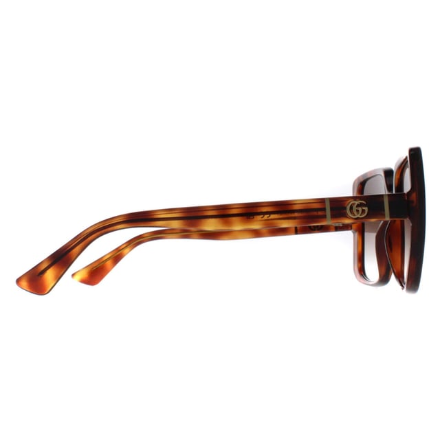 Gucci Square Womens Dark Havana Brown Gradient GG0632S  Sunglasses are a modern square frame that effortlessly complements any outfit. The frame is made from high-quality acetate, renowned for its durability and lightweight nature, ensuring a comfortable fit. Gucci's logo features on the slender temples for brand authenticity.
